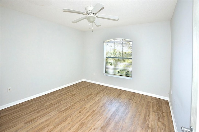 spare room with ceiling fan and light hardwood / wood-style floors