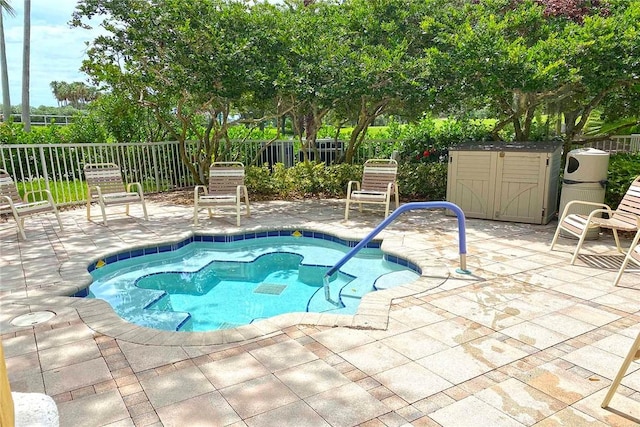 view of swimming pool with a patio