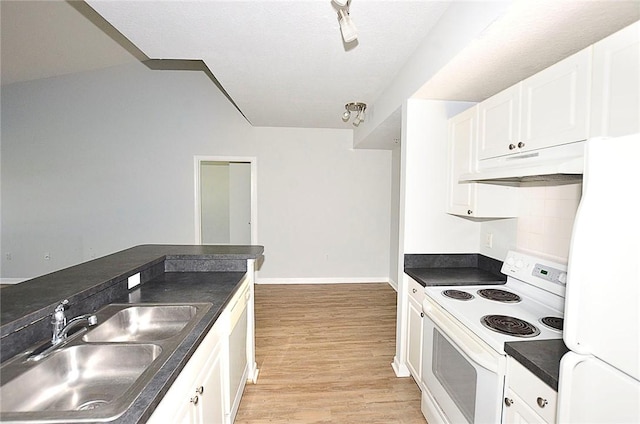 kitchen featuring fridge, sink, white cabinets, and white range with electric stovetop