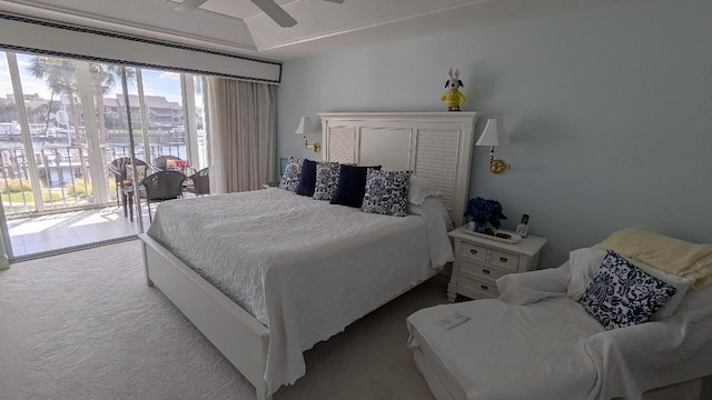 1903 Bay Rd Unit 206, Vero Beach, FL 32963 - bedroom with carpet floors, access to outside, and a ceiling fan