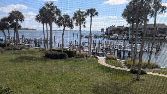 1903 Bay Rd Unit 206, Vero Beach, FL 32963 - dock featuring a lawn, a water view, and boat lift