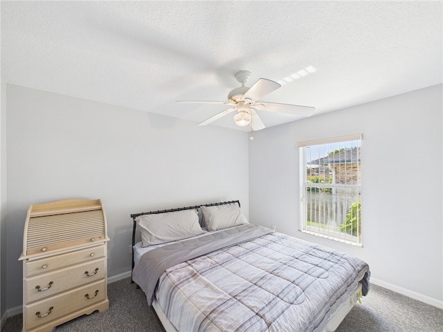 bedroom with carpet flooring, baseboards, and ceiling fan