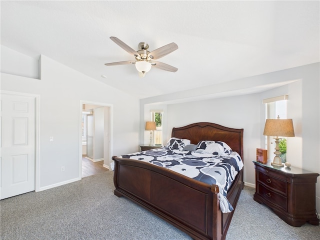 bedroom featuring ceiling fan, baseboards, carpet, and lofted ceiling