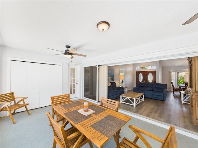 dining room featuring a ceiling fan and wood finished floors