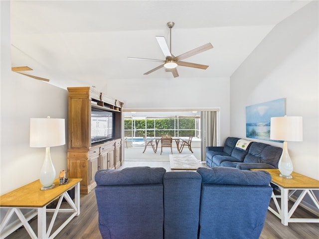 living room featuring lofted ceiling, wood finished floors, and a ceiling fan