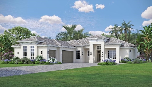 view of front of property featuring a garage and a front yard