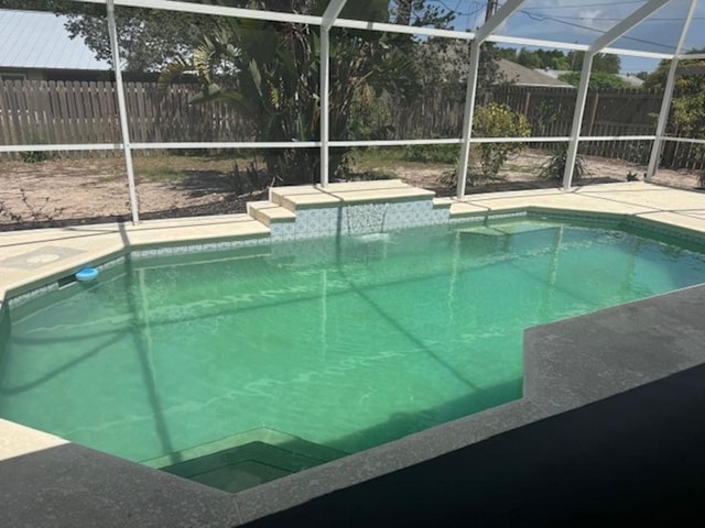 108 Cardinal Dr, Sebastian, FL 32958 - view of swimming pool featuring a lanai, a fenced backyard, and a patio