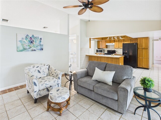 108 Cardinal Dr, Sebastian, FL 32958 - living room featuring ceiling fan, high vaulted ceiling, and light tile patterned floors