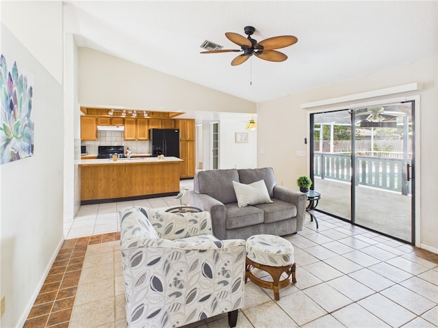 108 Cardinal Dr, Sebastian, FL 32958 - living area with vaulted ceiling, ceiling fan, and light tile patterned floors