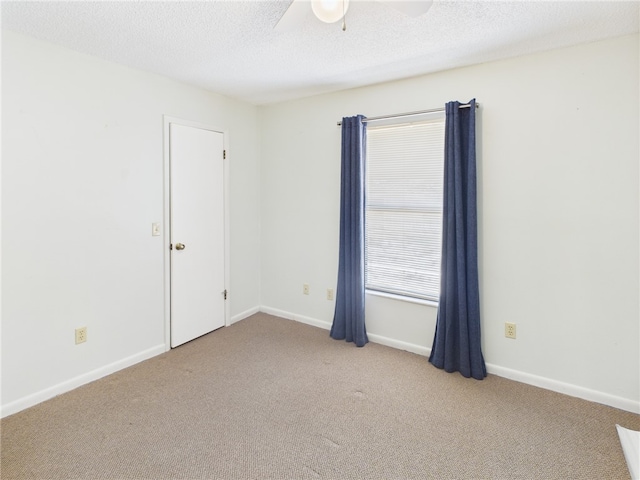 108 Cardinal Dr, Sebastian, FL 32958 - spare room featuring a ceiling fan, carpet, and a textured ceiling