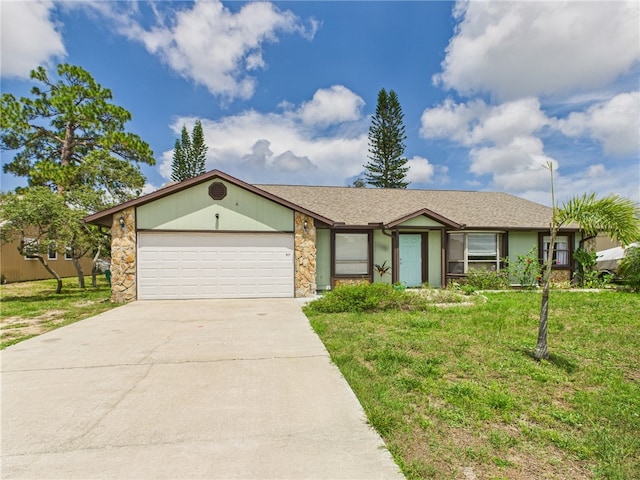 108 Cardinal Dr, Sebastian, FL 32958 - view of front of property featuring a garage, driveway, a front lawn, and stone siding