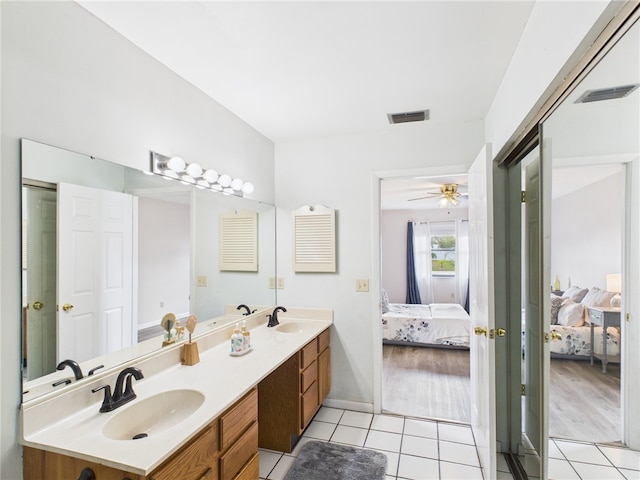 108 Cardinal Dr, Sebastian, FL 32958 - ensuite bathroom with double vanity, tile patterned floors, and ceiling fan