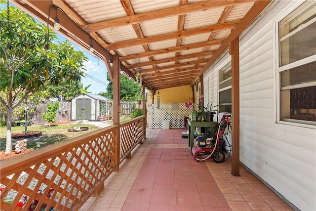 1359 Damask Ln, Sebastian, FL 32958 - view of patio / terrace with a storage shed, an outbuilding, and fence