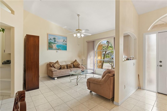 1359 Damask Ln, Sebastian, FL 32958 - living room with light tile patterned floors, ceiling fan, and vaulted ceiling
