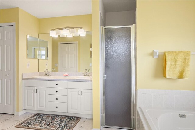 1359 Damask Ln, Sebastian, FL 32958 - full bath with tile patterned flooring, a stall shower, double vanity, and a bath