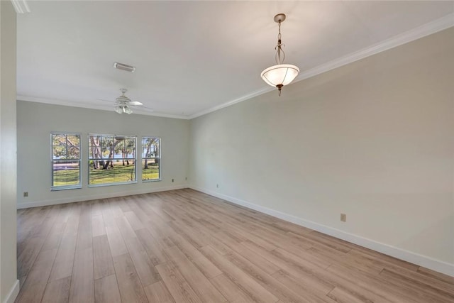 interior space featuring ornamental molding, ceiling fan, and light wood-type flooring