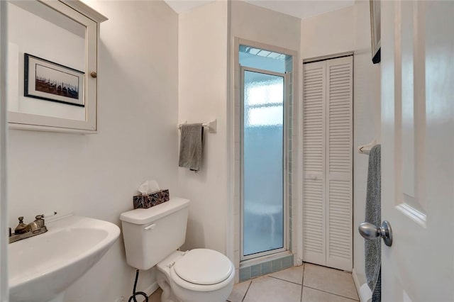 bathroom with tile patterned flooring, sink, and toilet