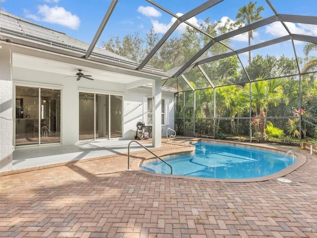 pool featuring a patio, a ceiling fan, and a lanai