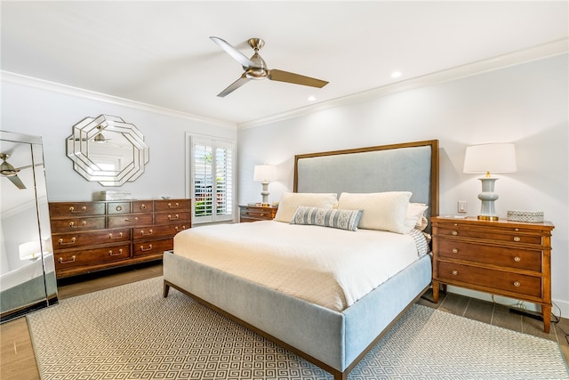 bedroom with wood-type flooring, ceiling fan, and crown molding