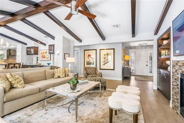 bar featuring vaulted ceiling with beams, dark brown cabinets, light wood-type flooring, and wine cooler