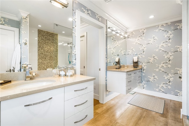 bathroom with tile patterned flooring, vanity, and ornamental molding