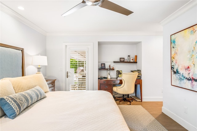 bedroom featuring ceiling fan, wood-type flooring, and ornamental molding