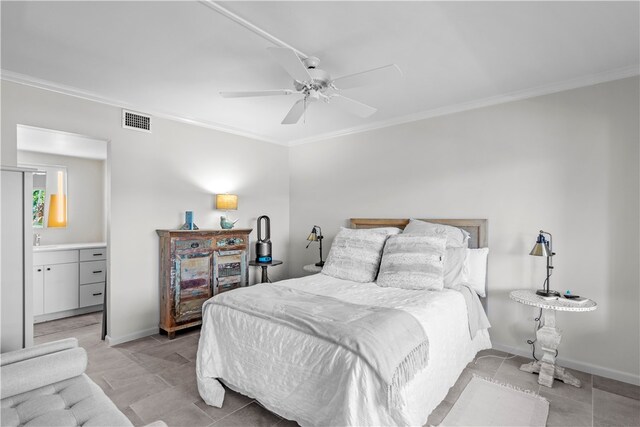 bedroom with ornamental molding, sink, ceiling fan, and ensuite bath