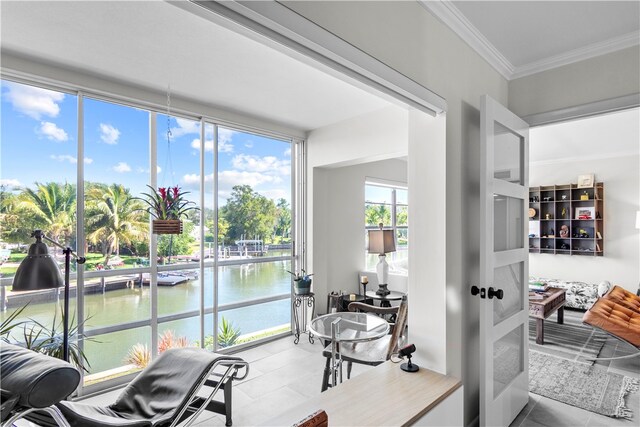 sunroom with a water view