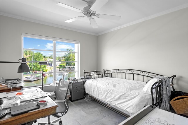 bedroom featuring ornamental molding, a water view, and ceiling fan