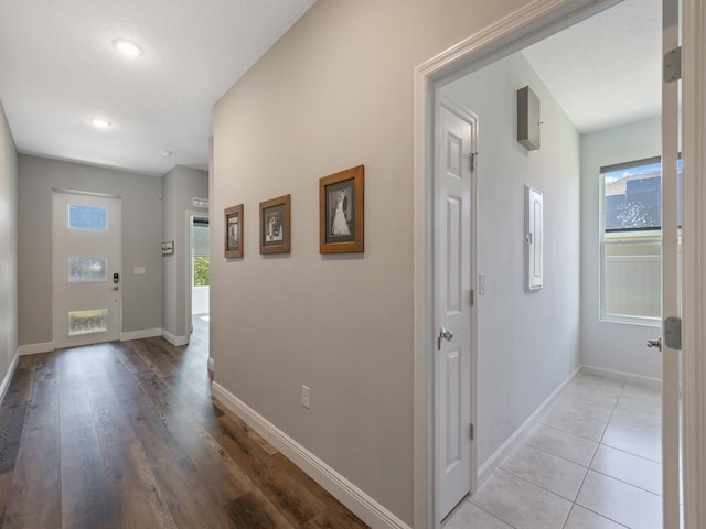 entryway featuring light tile patterned floors and baseboards