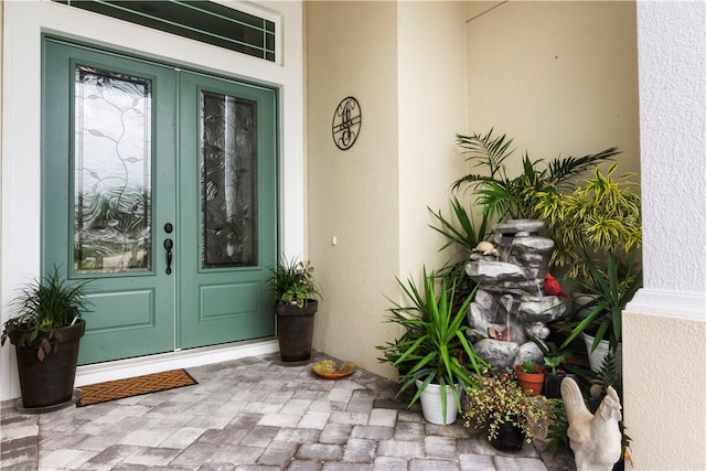 entrance to property featuring french doors