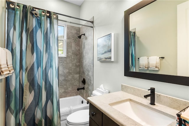 full bathroom with shower / bath combo, vanity, and toilet