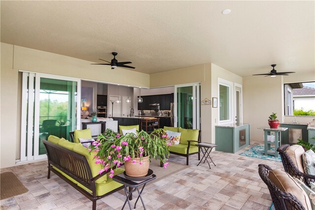 view of patio with an outdoor hangout area and ceiling fan