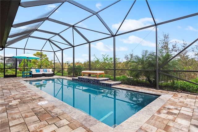 view of pool featuring a lanai and a patio area