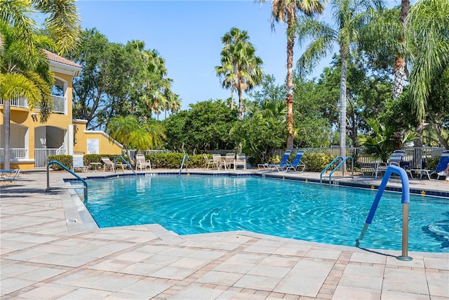 view of swimming pool with a patio area