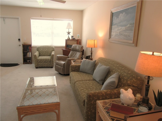 living room with ceiling fan and carpet floors