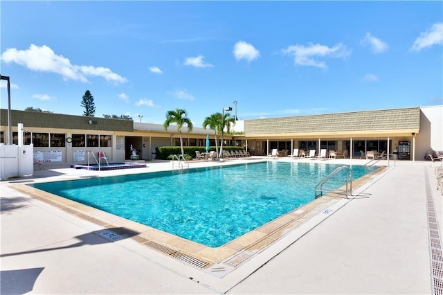 view of pool featuring a patio