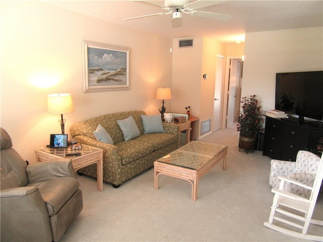 living room featuring ceiling fan and light colored carpet