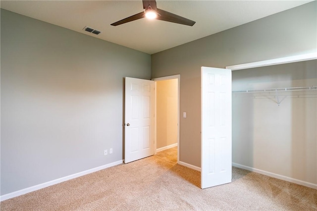 2115 Crowned Eagle Cir SW, Vero Beach, FL 32962 - unfurnished bedroom featuring carpet, a closet, and ceiling fan