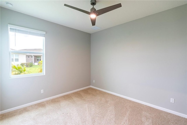 2115 Crowned Eagle Cir SW, Vero Beach, FL 32962 - spare room featuring carpet, a ceiling fan, and a smoke detector