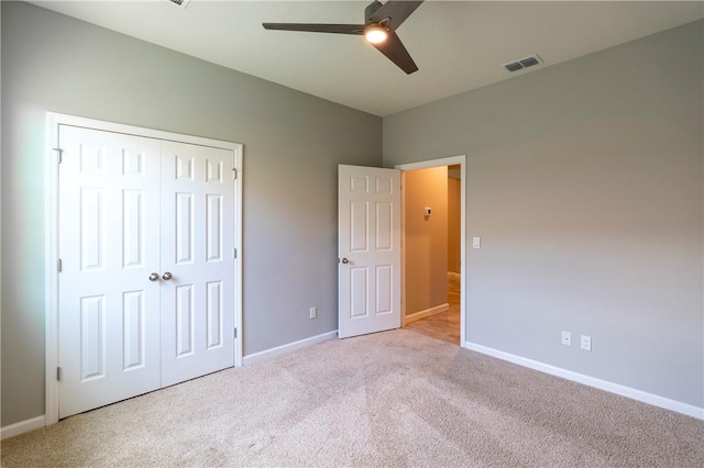2115 Crowned Eagle Cir SW, Vero Beach, FL 32962 - unfurnished bedroom with carpet floors, a closet, and a ceiling fan