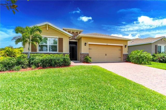 2115 Crowned Eagle Cir SW, Vero Beach, FL 32962 - view of front of property with stucco siding, a garage, and a front yard