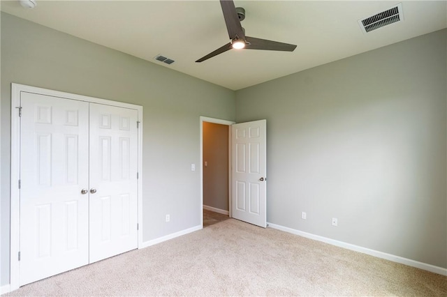 2115 Crowned Eagle Cir SW, Vero Beach, FL 32962 - unfurnished bedroom featuring carpet, a closet, and a ceiling fan
