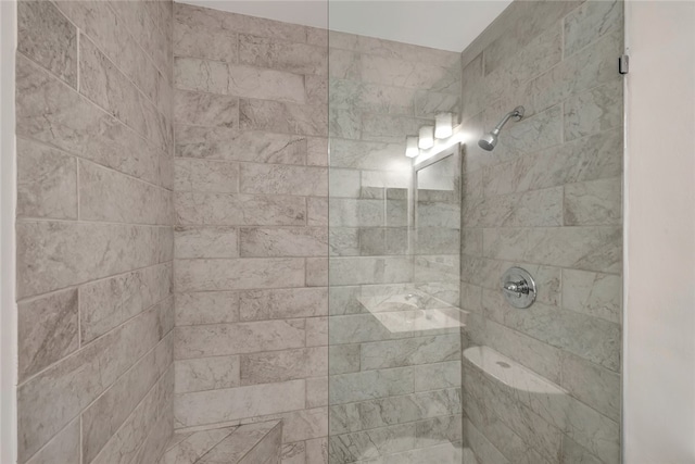 bathroom with tiled shower