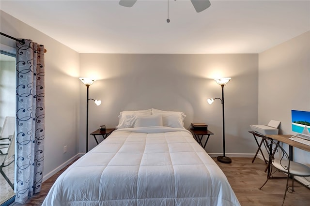 bedroom with hardwood / wood-style flooring and ceiling fan