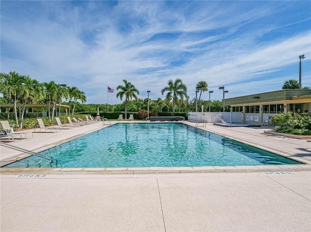 community pool featuring a patio area