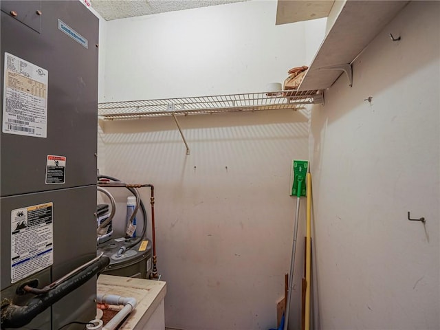clothes washing area featuring heating unit