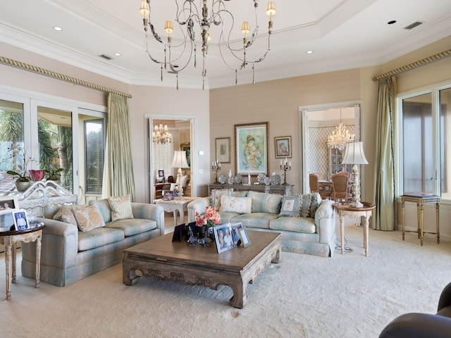 living room with a chandelier, light carpet, and crown molding