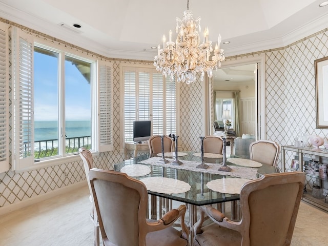 dining room featuring a chandelier, light carpet, and crown molding