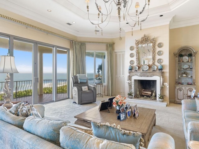 186 Ocean Way, Vero Beach, FL 32963 - dining area featuring a tray ceiling, light colored carpet, a chandelier, healthy amount of natural light, and ornamental molding